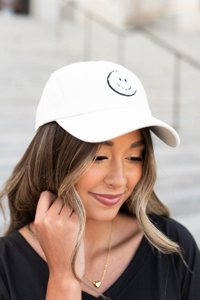 Side view of the off white sherpa happy face hat