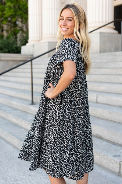 Side view of the black ditsy floral dress