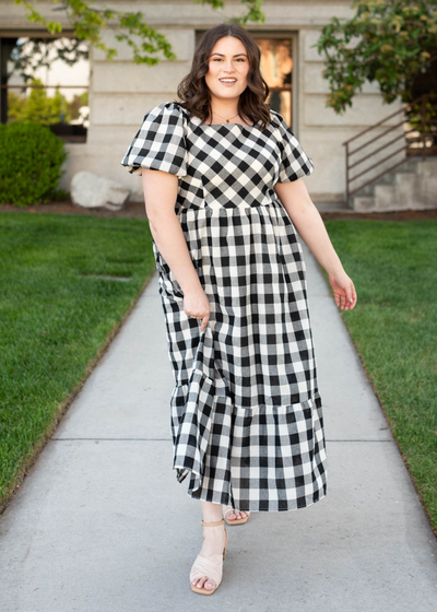 Plus size black gingham dress with wide ruffle at the bottom