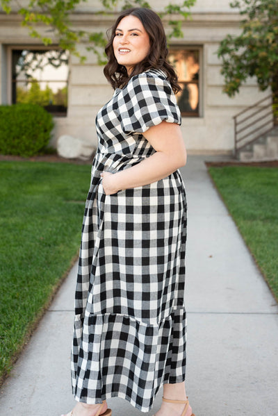 Side view of the black gingham dress in plus size