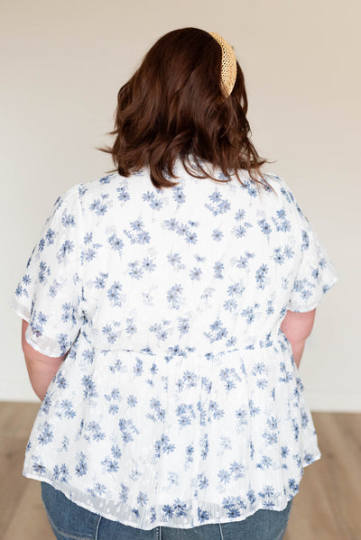 Back view of the plus size blue floral blouse