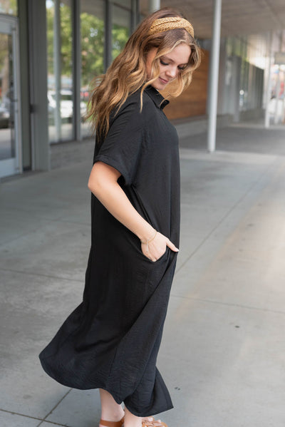 Side view of the black button up maxi dress