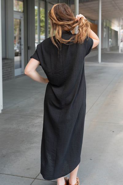 Back view of the black button up maxi dress