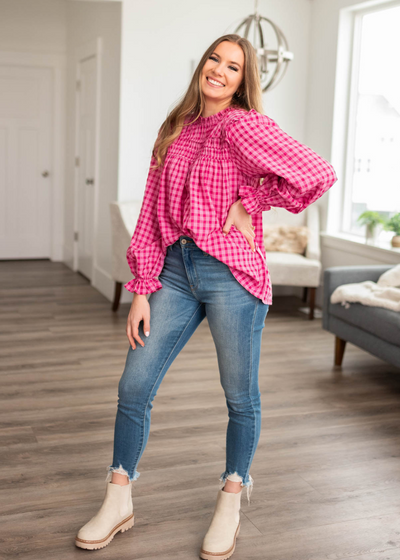 Long sleeve pink fuchsia ruffle blouse with smocking around the neck