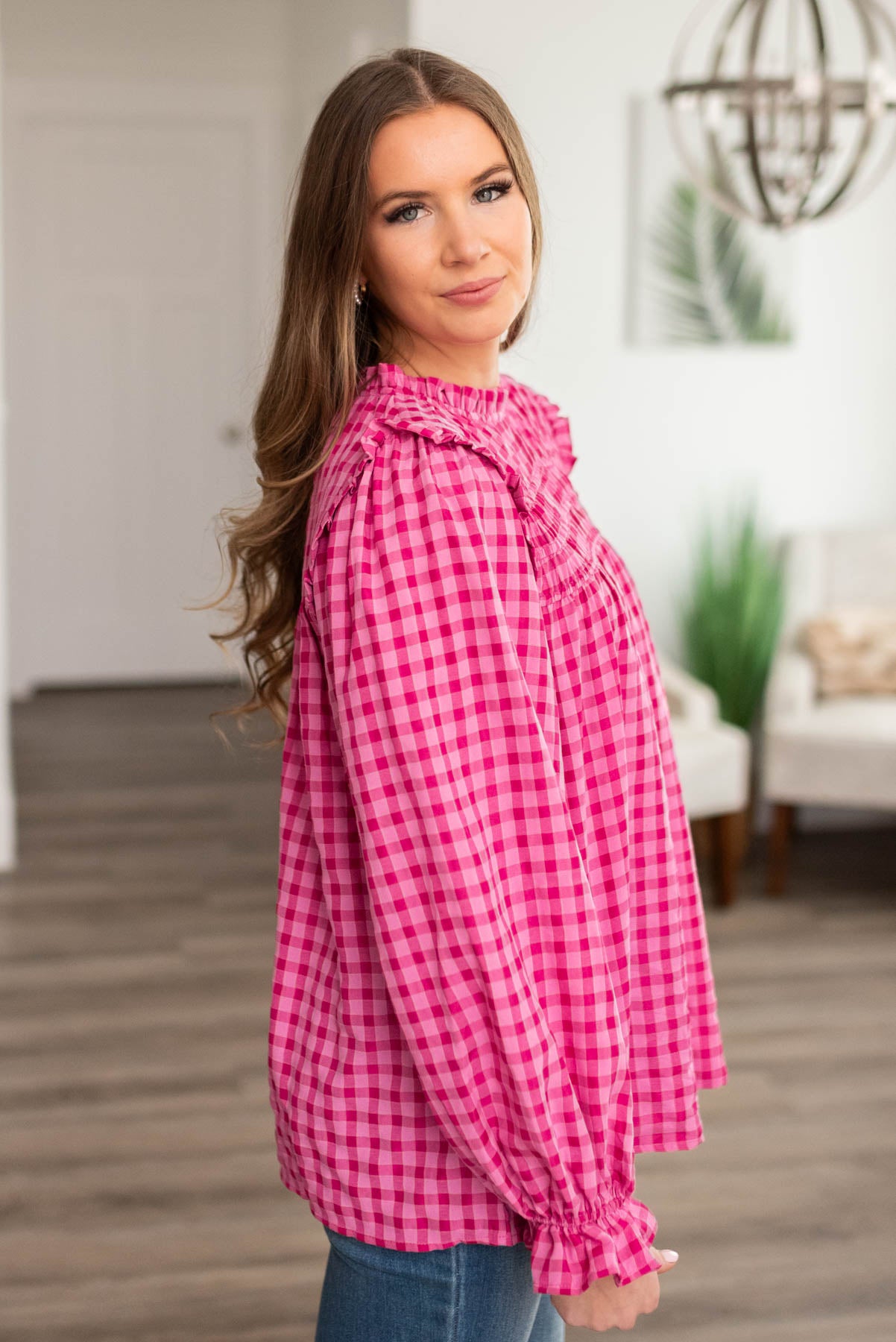 Side view of the pink fuchsia ruffle blouse