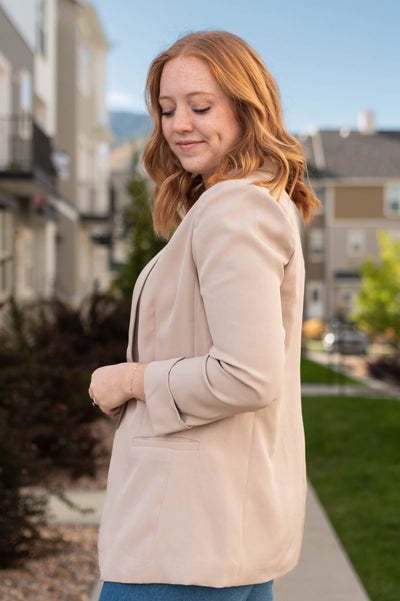 Side view of a beige blazer