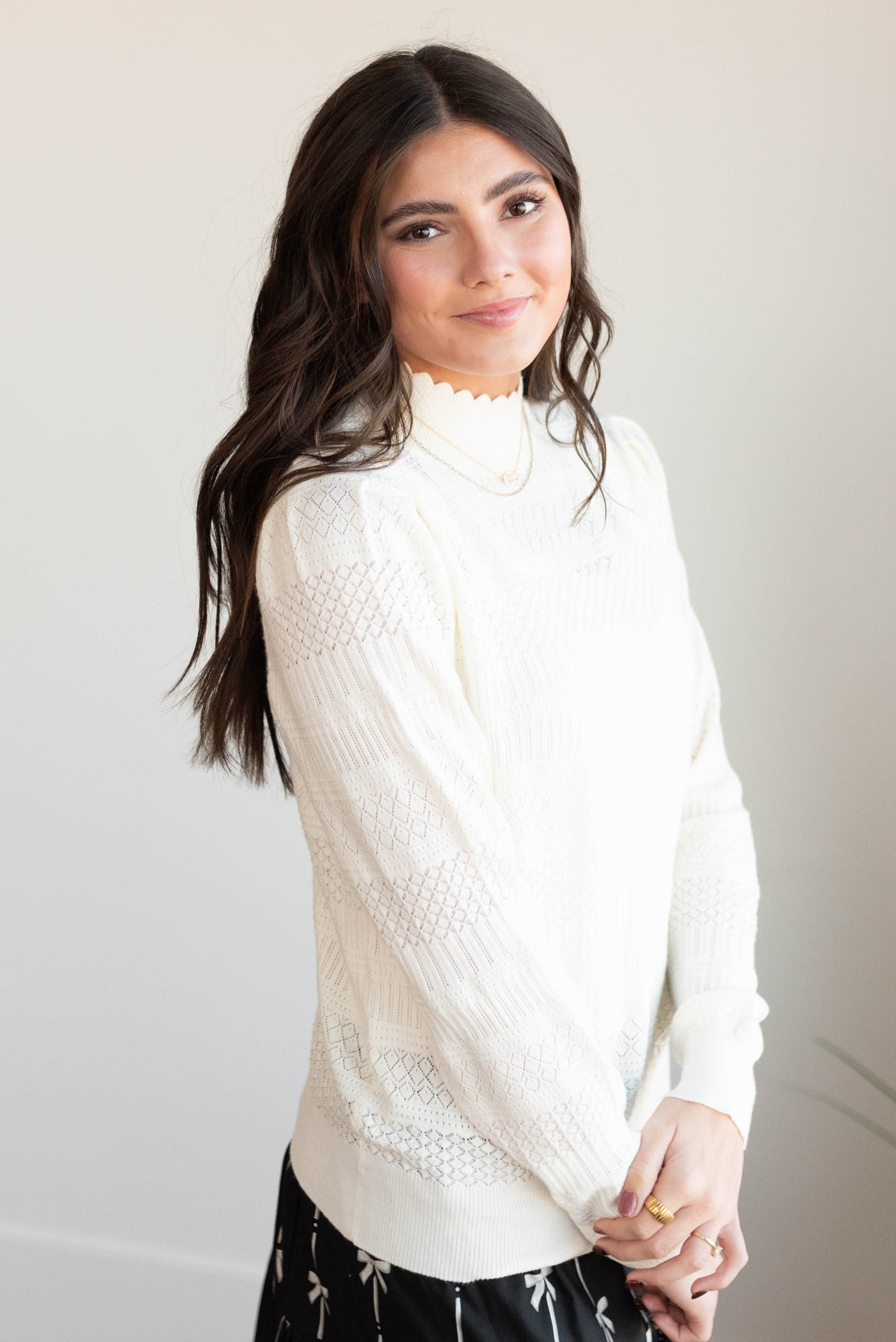 Side view of the ivory pattern sweater