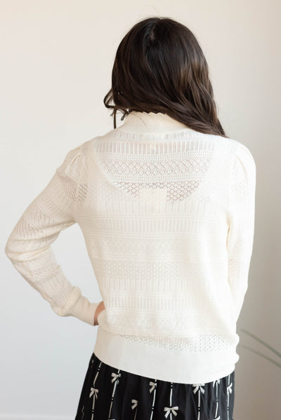 Back view of the ivory pattern sweater