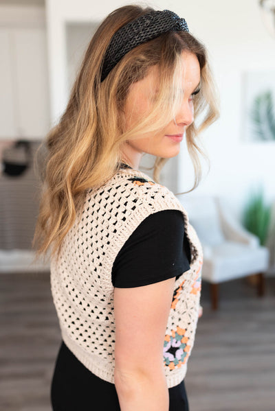 Side view of the beige crochet knit top