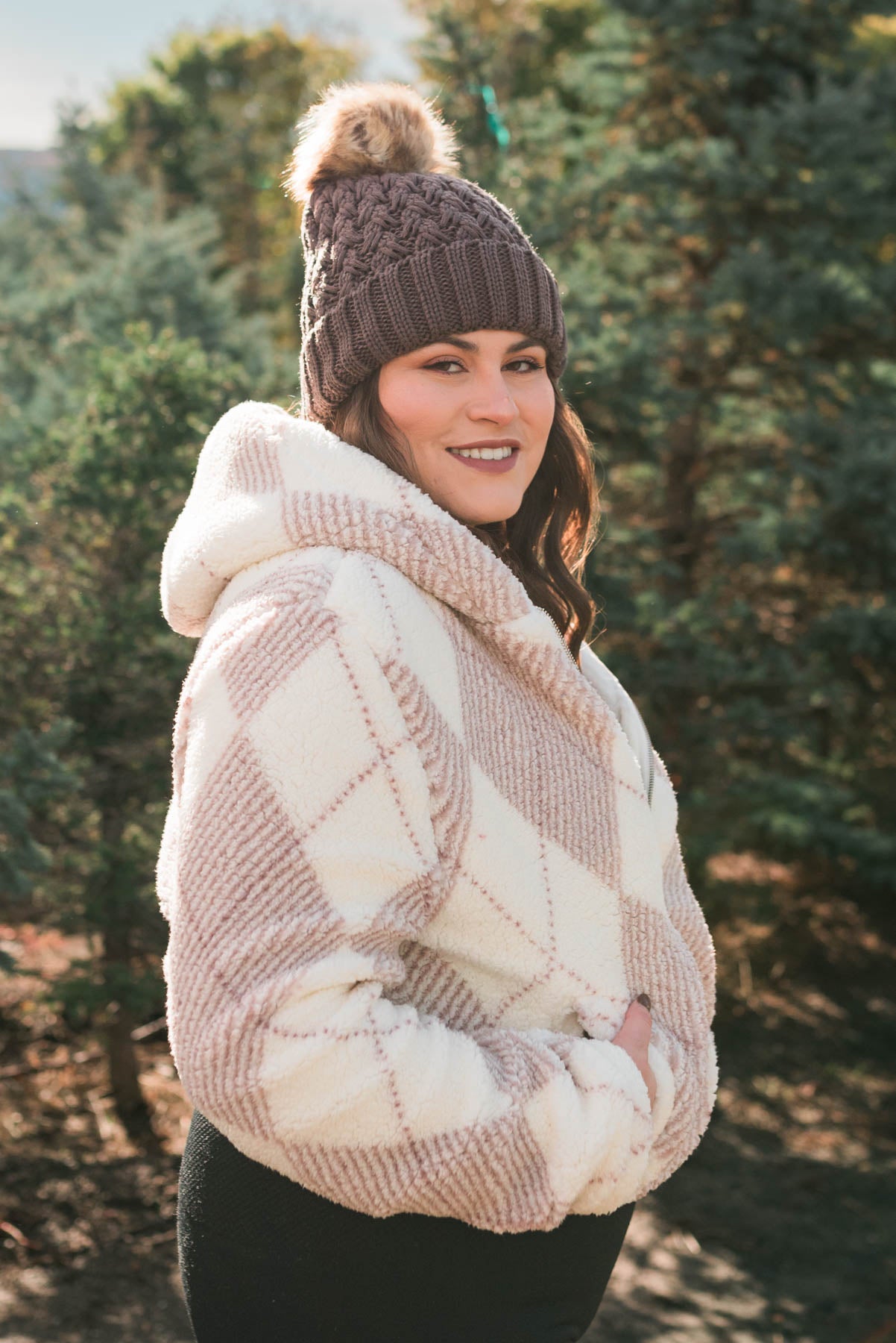 Side view of a plus size pink plaid Sherpa with pockets