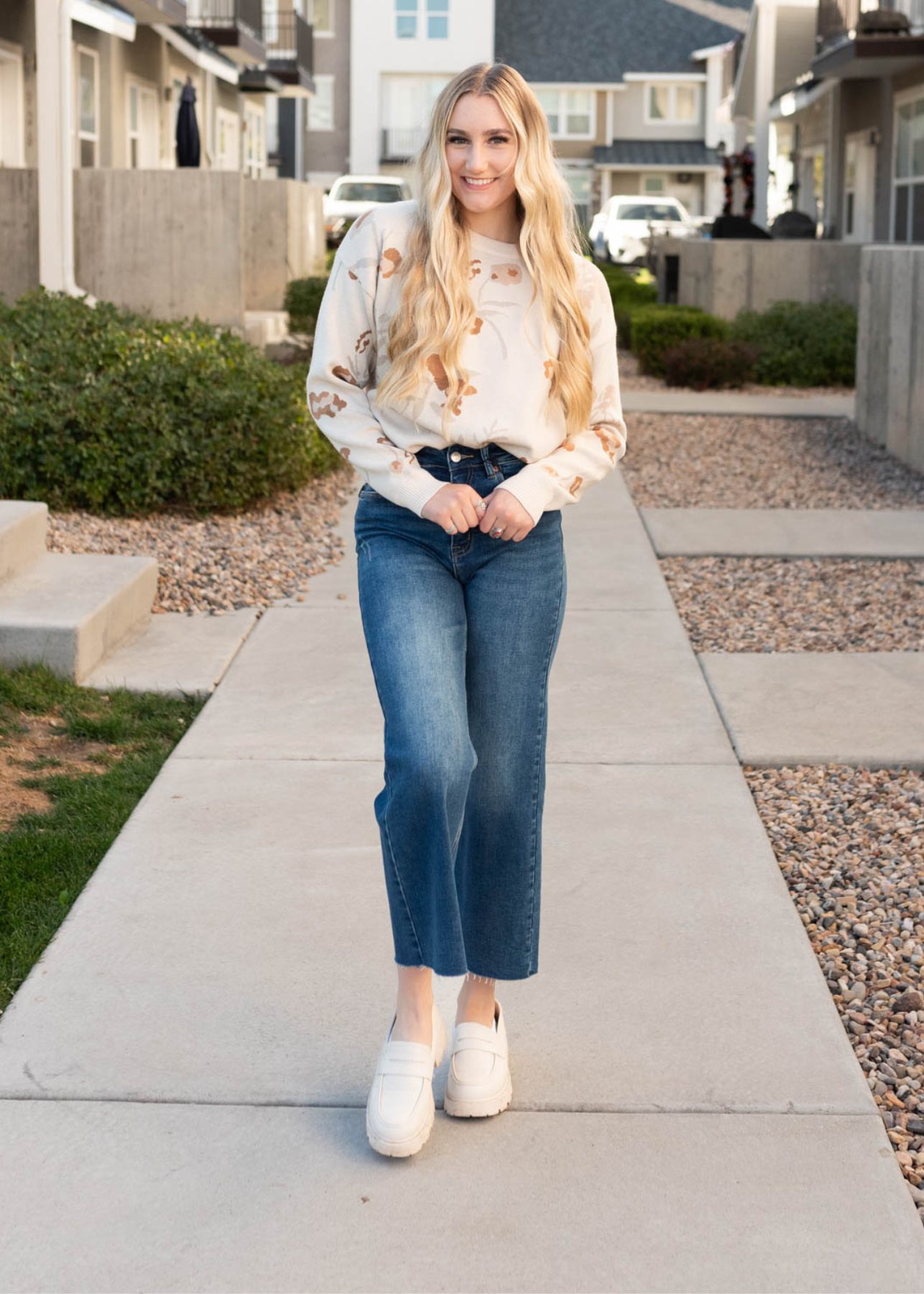 Front view of the oatmeal floral sweater