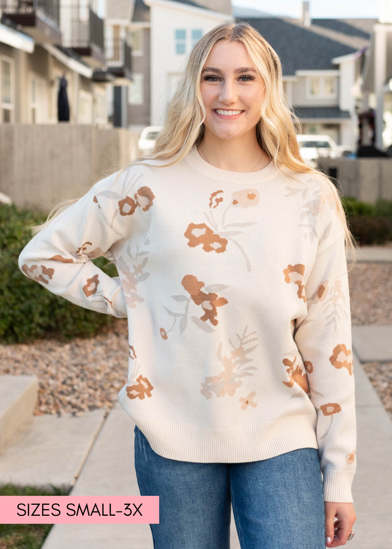 Close up of the floral print on the oatmeal floral sweater