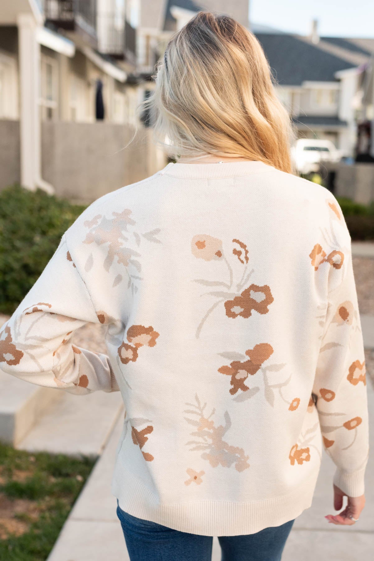 Back view of the oatmeal floral sweater