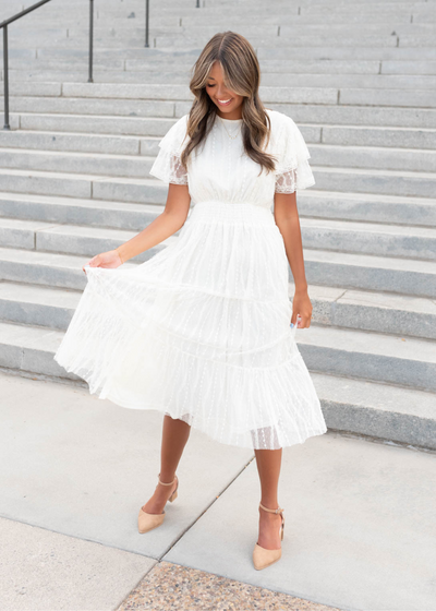 Front view of the cream lace dress