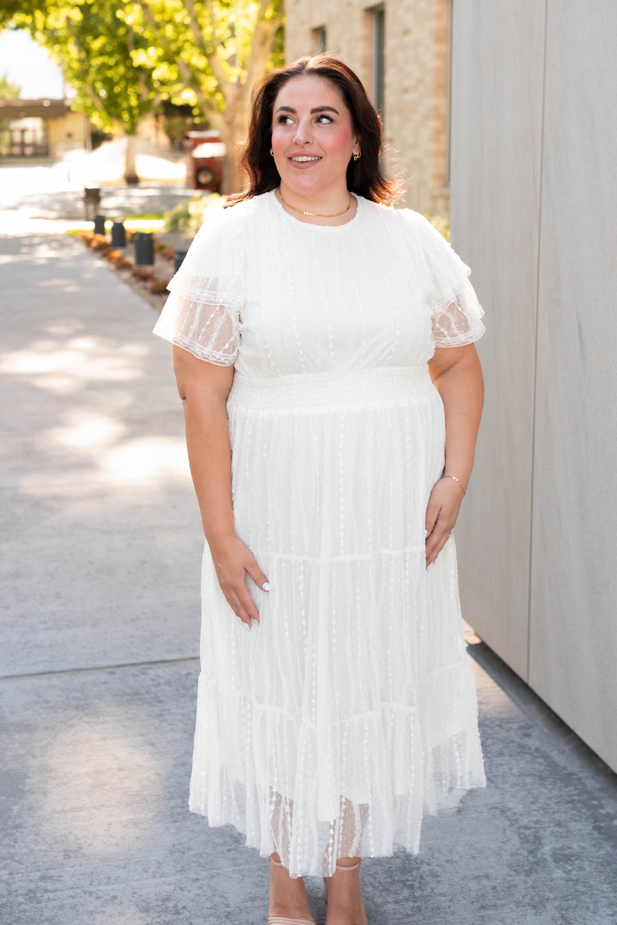 Front view of the plus size cream lace dress