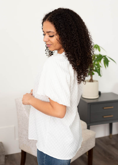 Side view of the white textured top