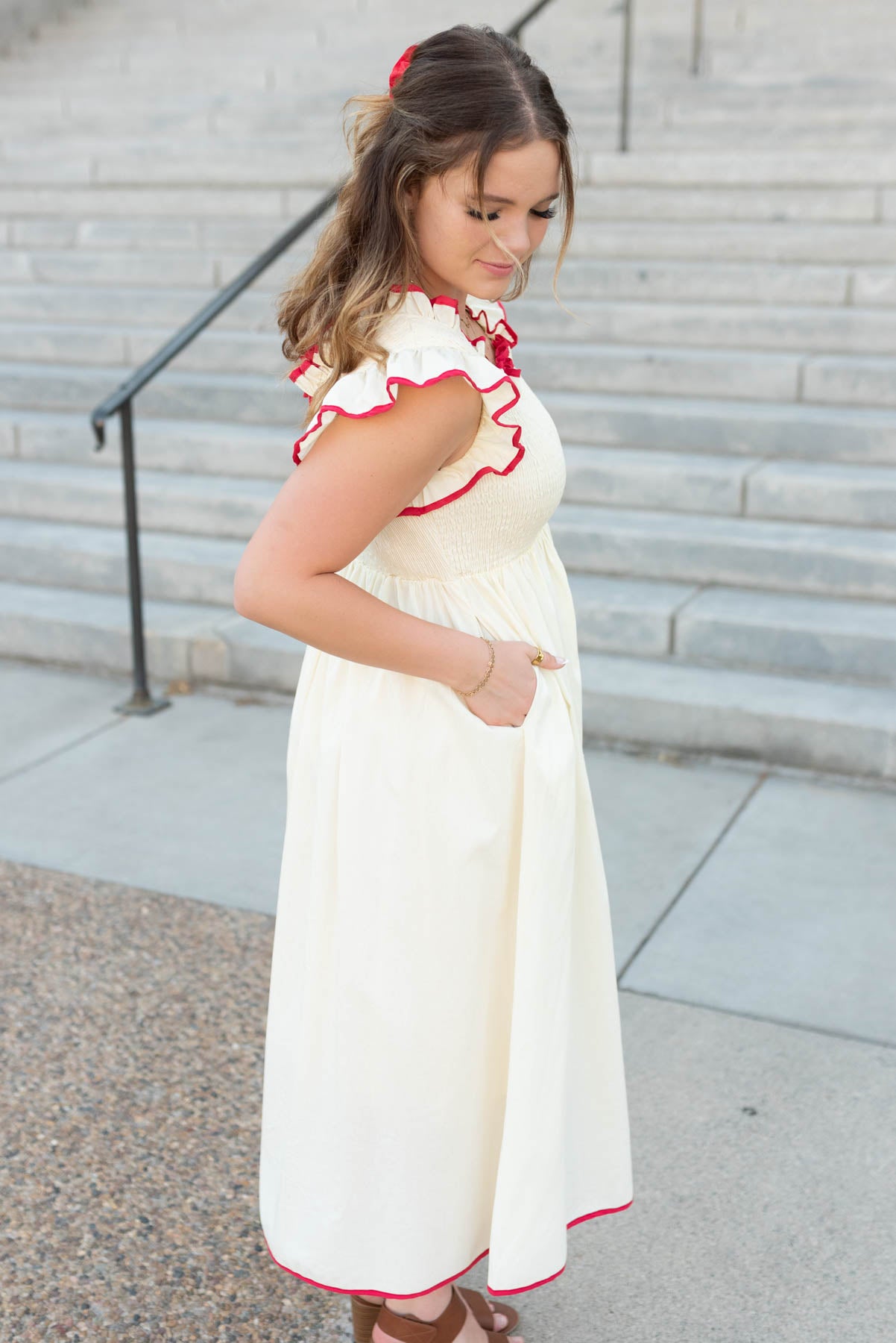 Side view of the cream red midi dress