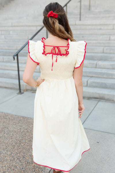 Back view of the cream red midi dress