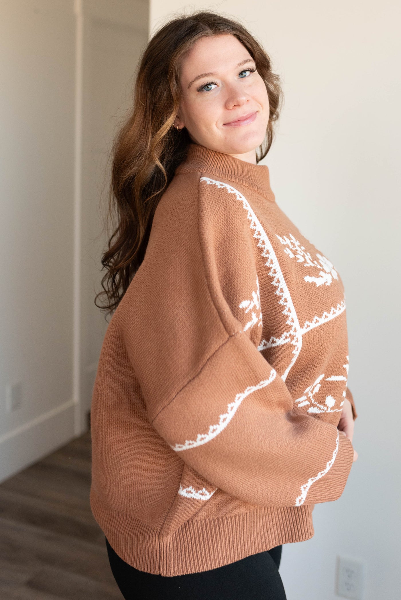 Side view of the plus size mocha floral printed sweater