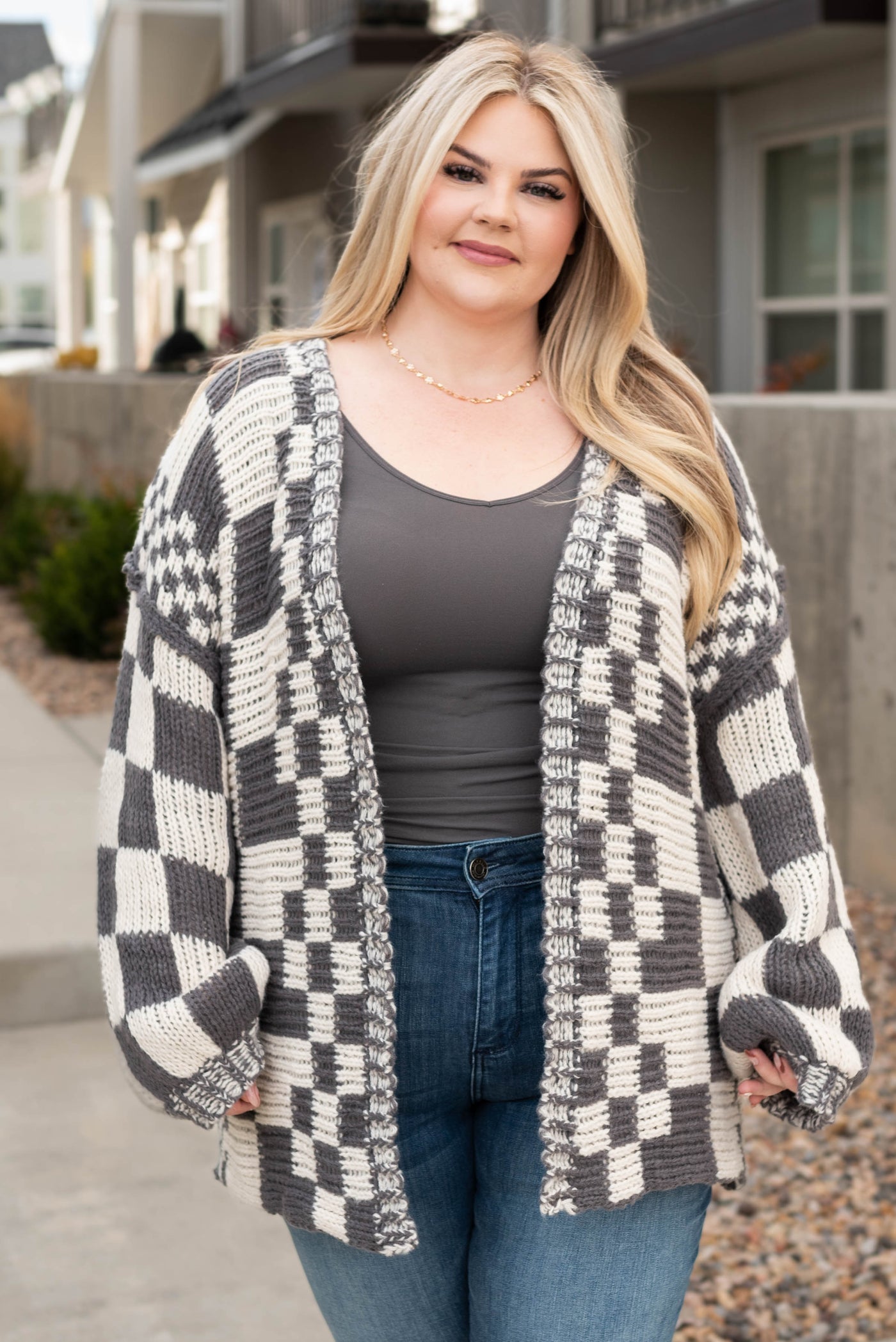 Front view of the plus size charcoal cardigan