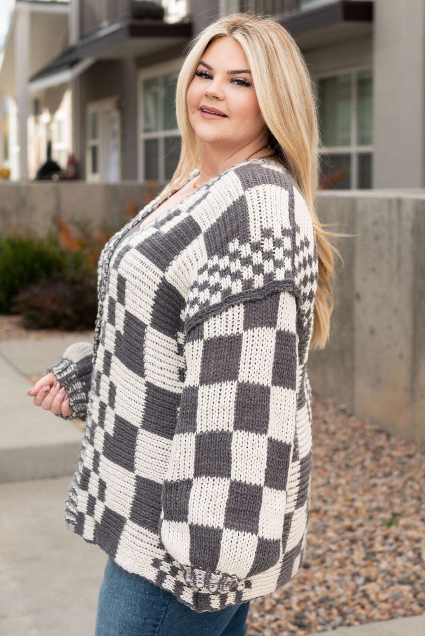 Side view of the plus size charcoal cardigan