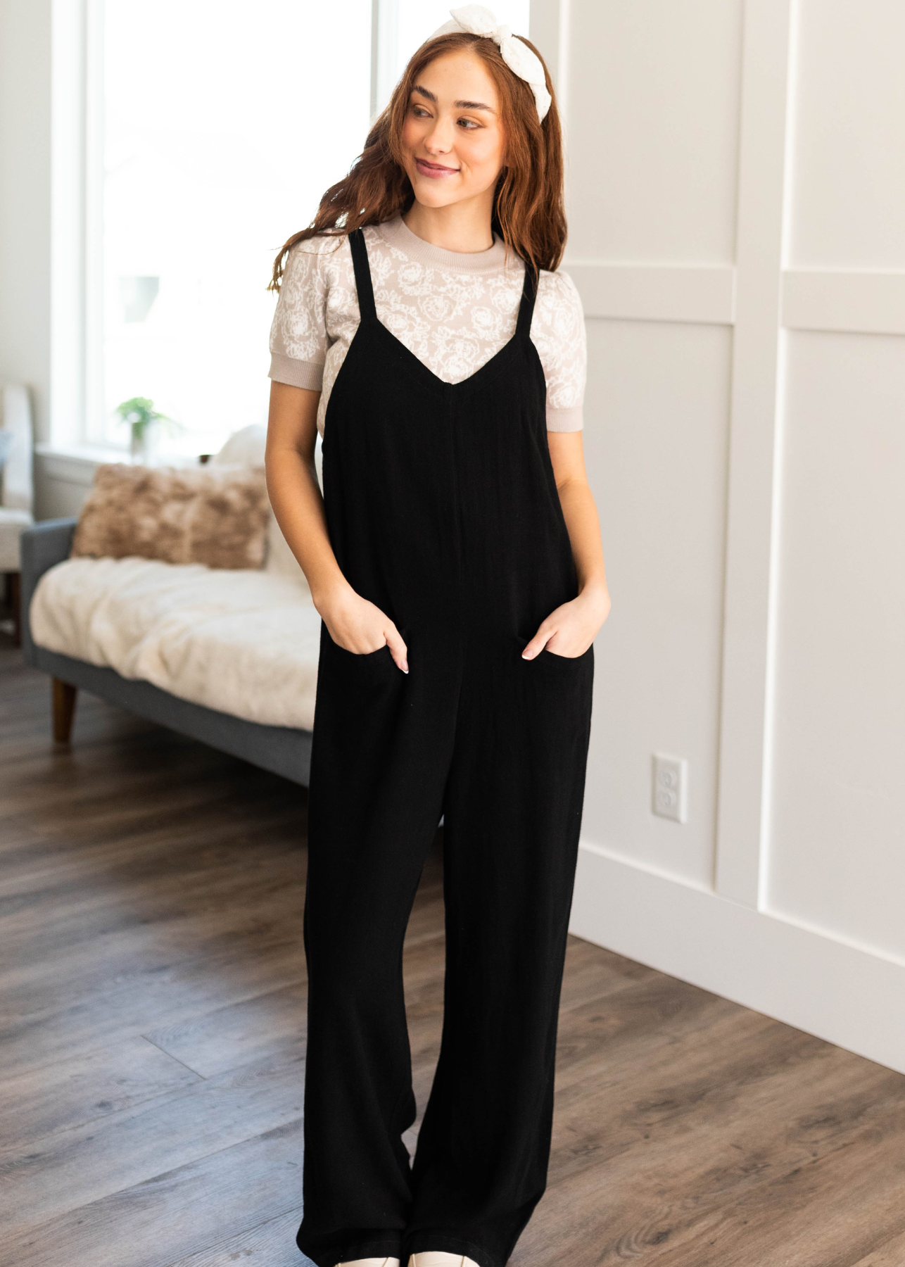 Front view of the black jumpsuit with pockets