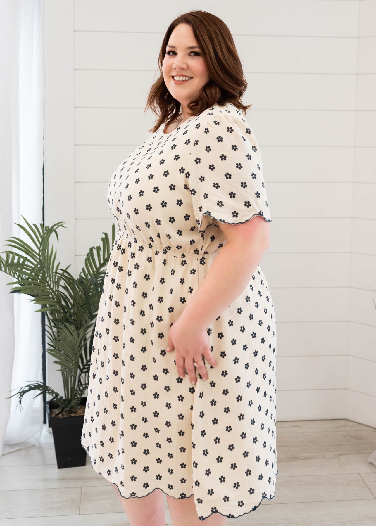 Side view of the navy floral dress in plus size