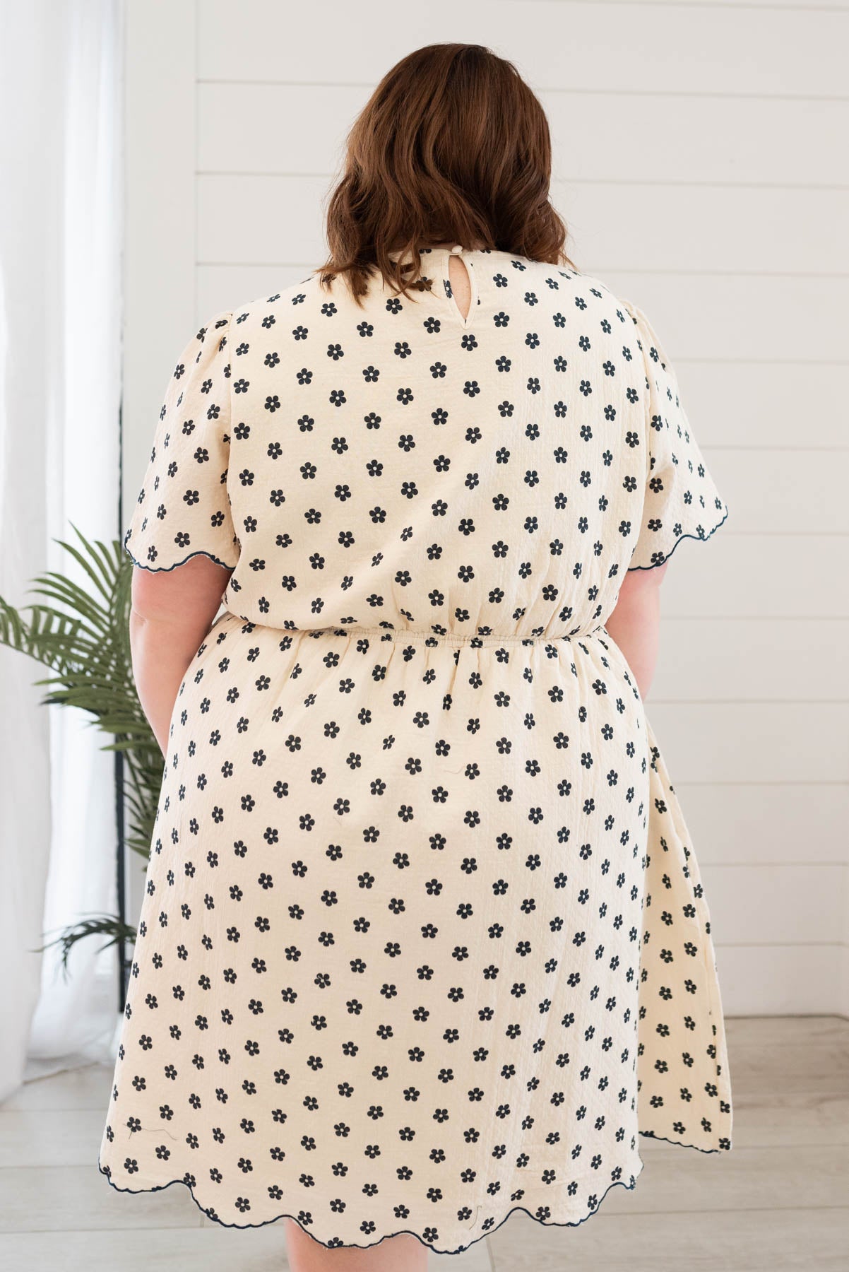 Back view of the navy floral dress in plus size