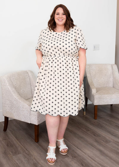 Navy floral dress with short sleeves and pockets