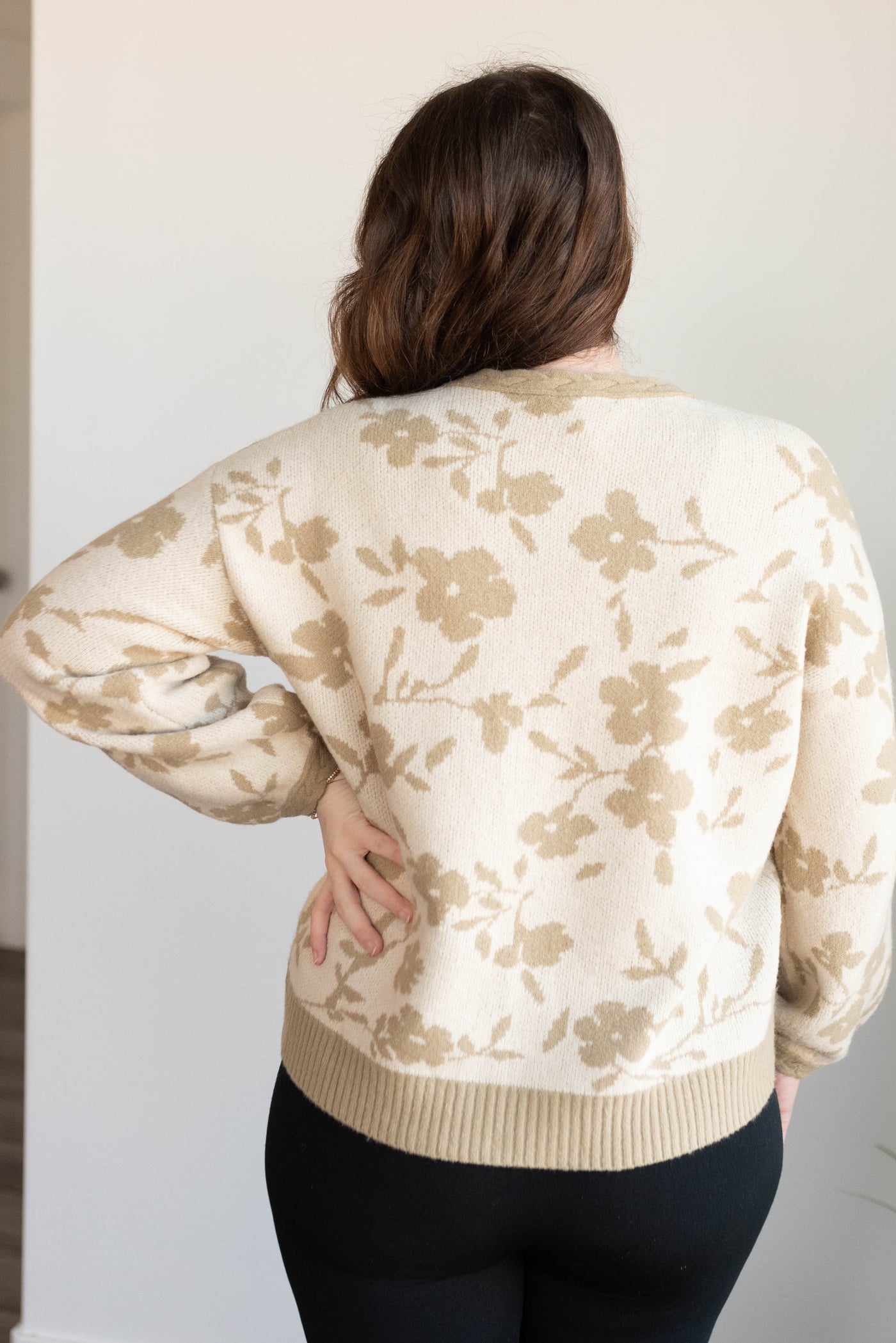 Back view of the taupe floral cardigan