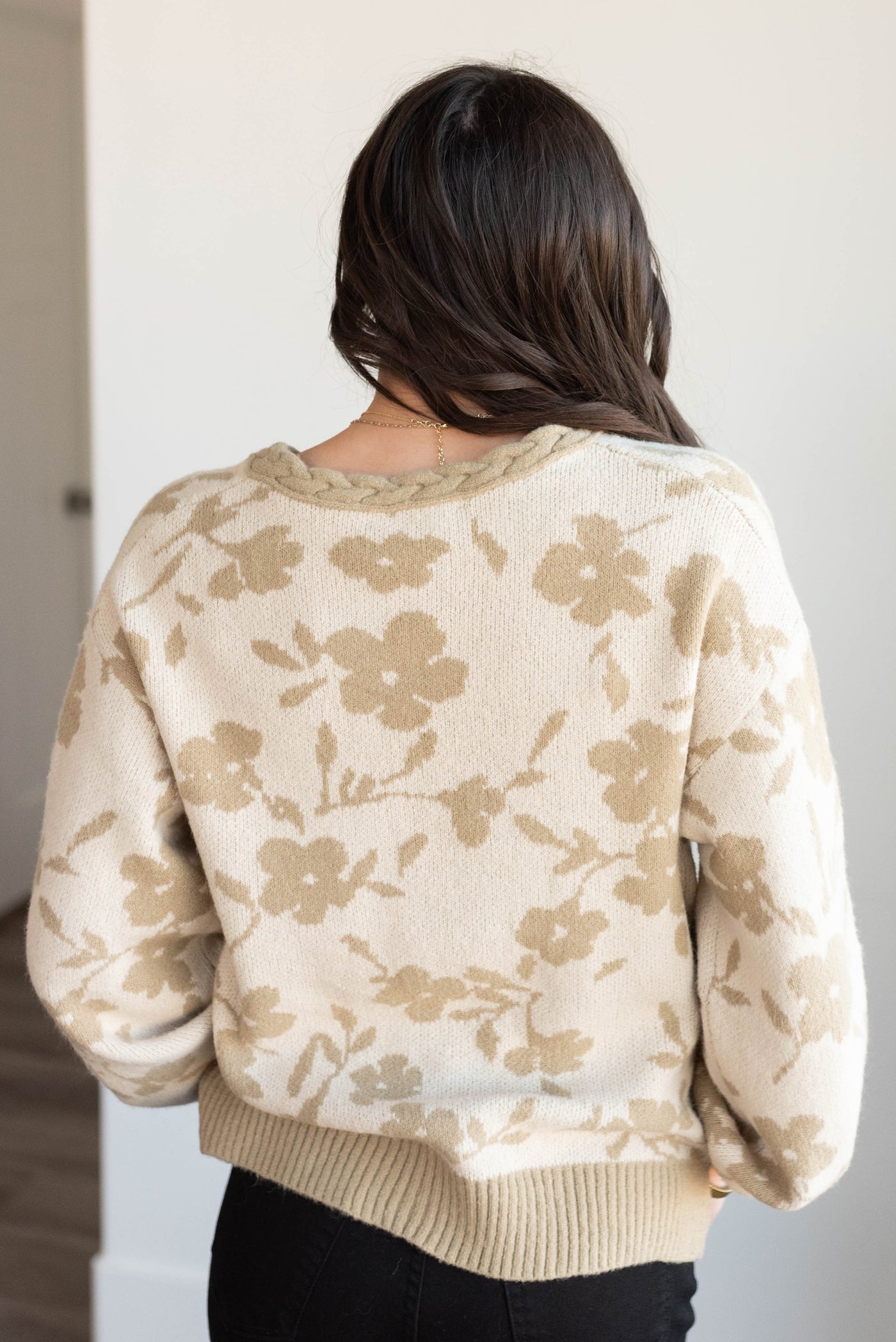 Back view of the taupe floral cardigan