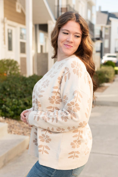 Side view of the oatmeal floral sweater in plus size