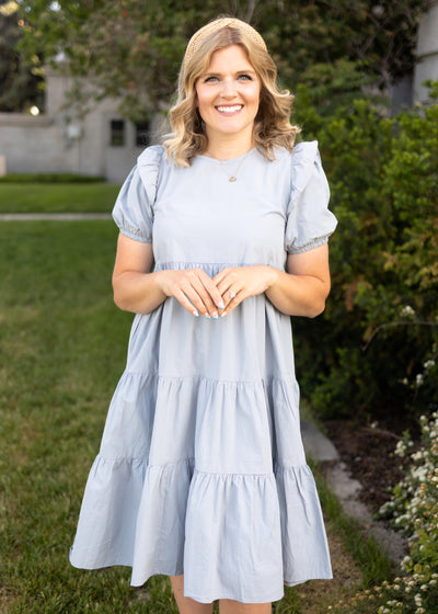 Stone blue dress with short sleeves and tiered skirt