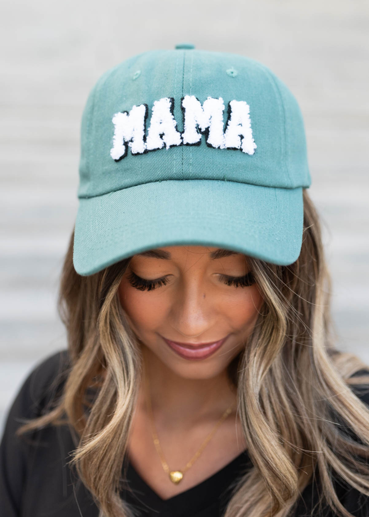 Close up of the dark teal Sherpa Mama hat