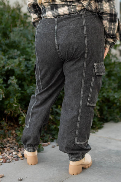 Back view of plus size black cargo parachute pants