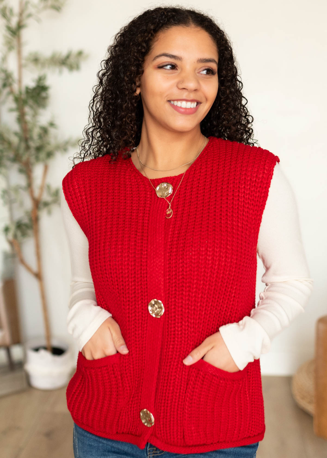 Close up of the red knit sweater vest with pockets