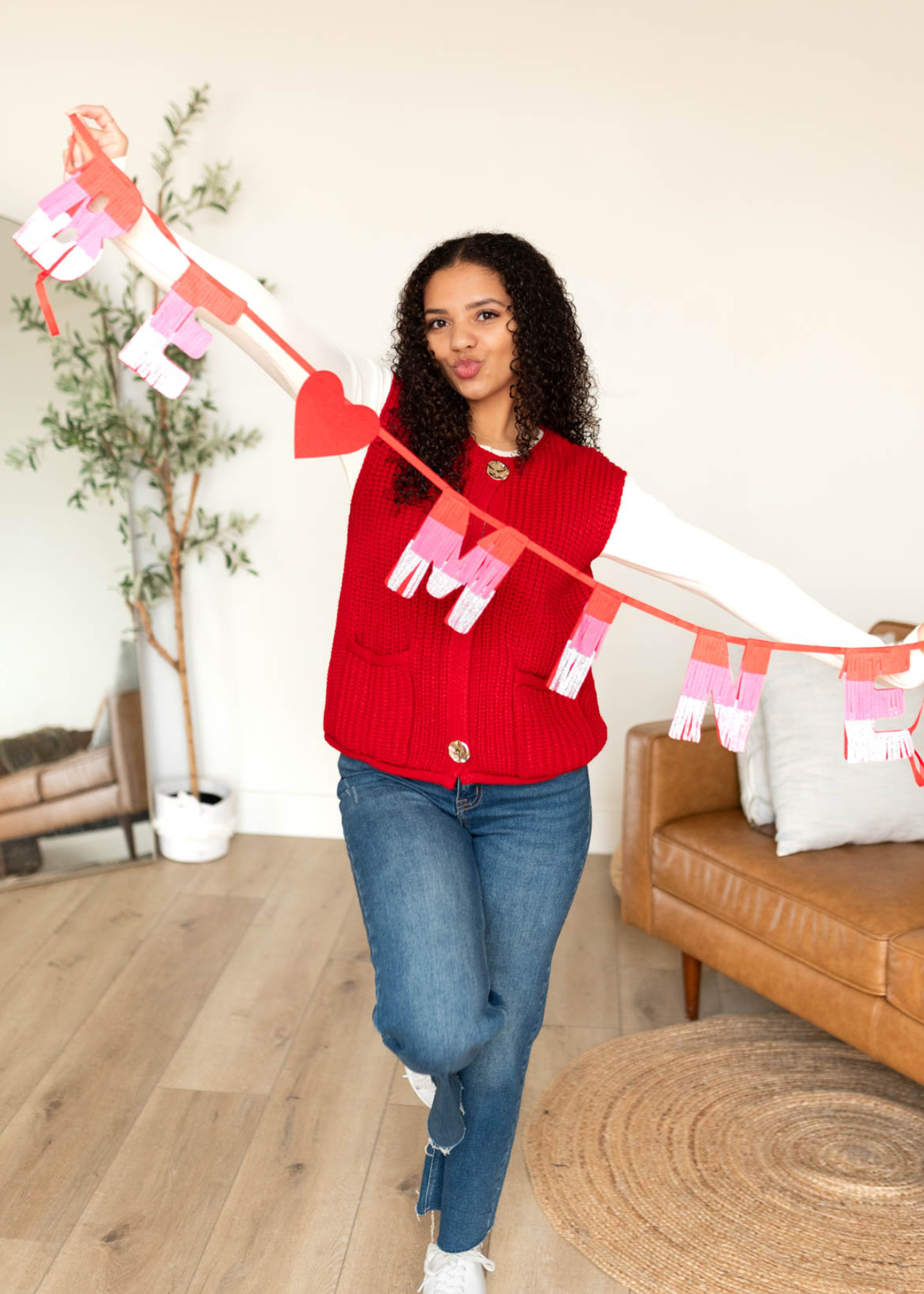 Red knit sweater vest with three buttons