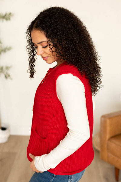 Side view of the red knit sweater vest