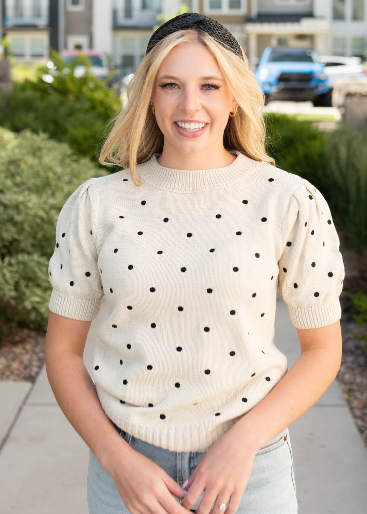 Front view of the cream black dot sweater