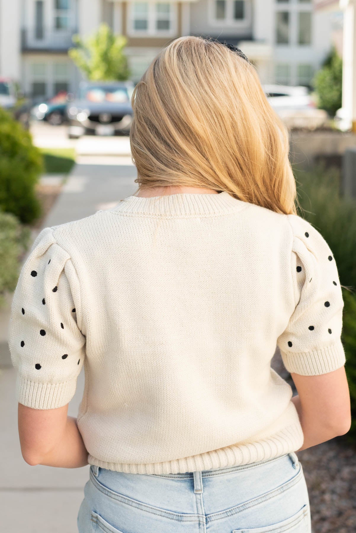 Back view of the ceam black dot sweater