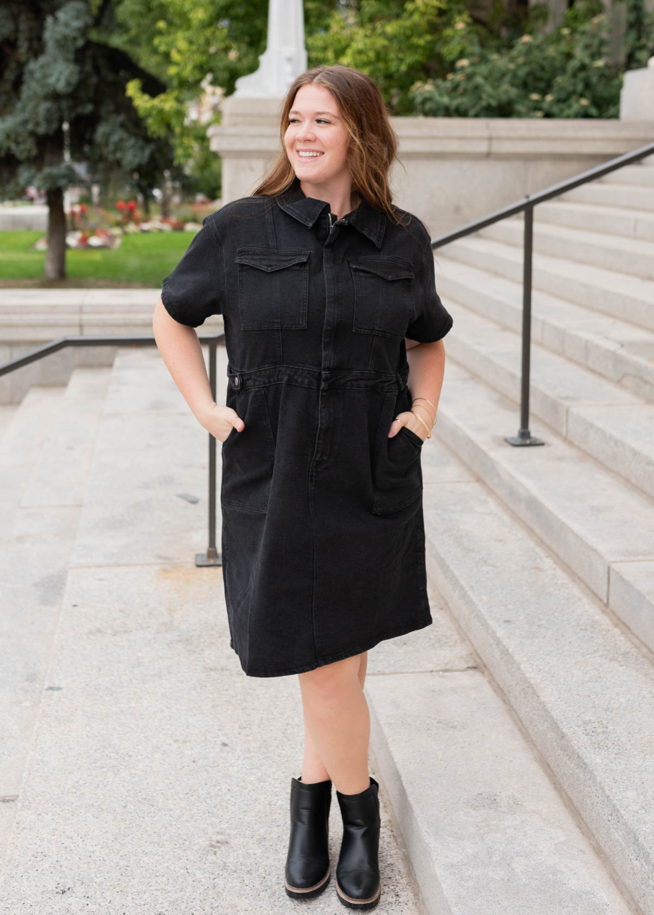 Plus size black denim zipper dress with front pockets and a collar