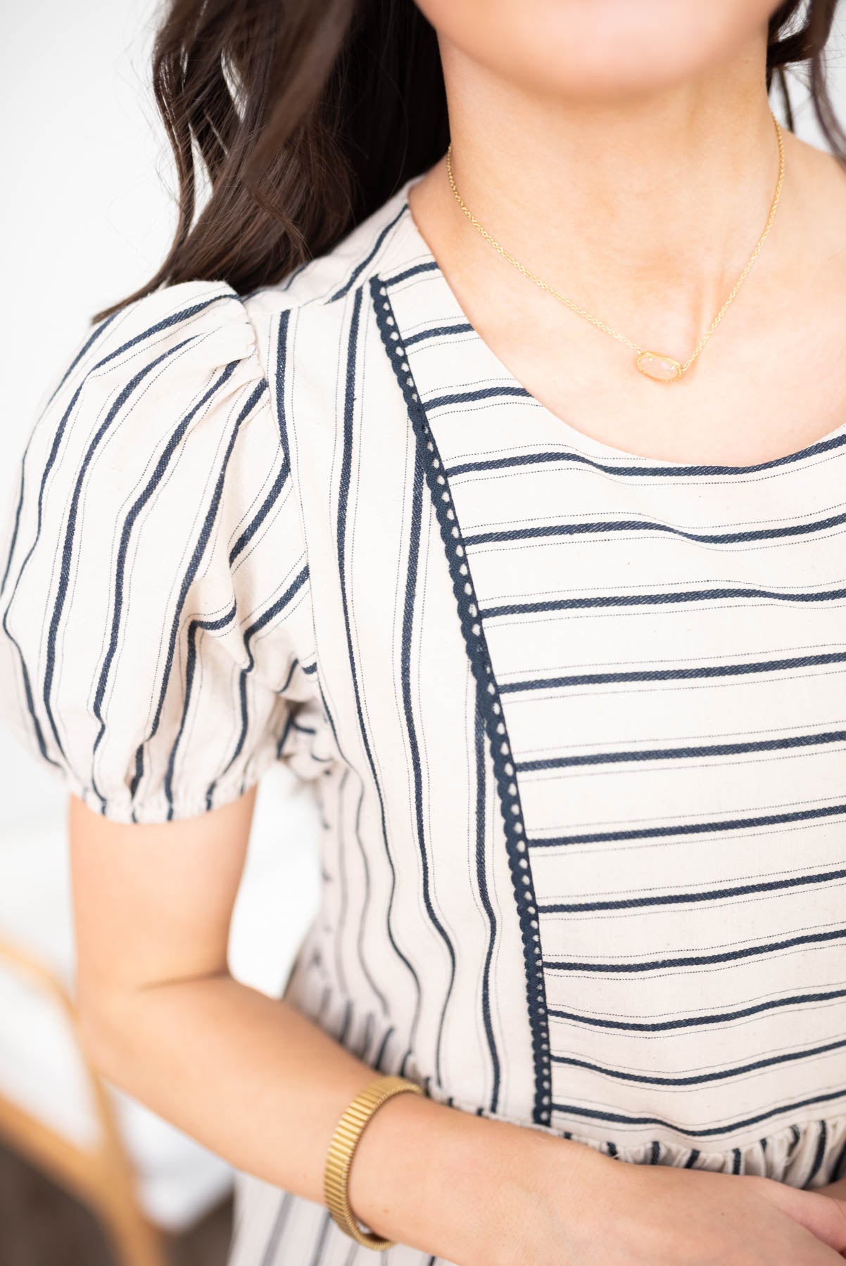 Close up of the fabric and sleeve on the navy stripe dress