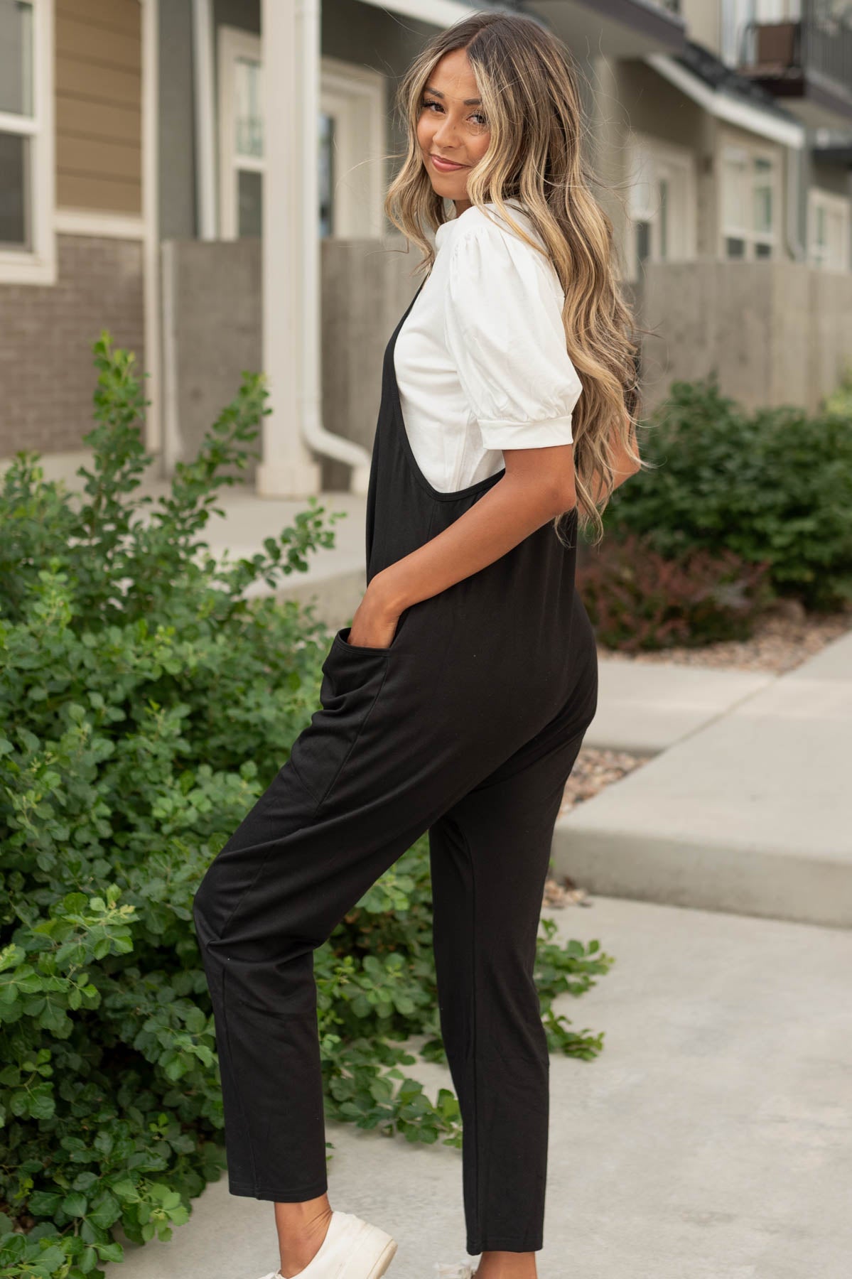 Side view of a black jumpsuit