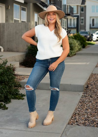 White sweater vest with a v-neck