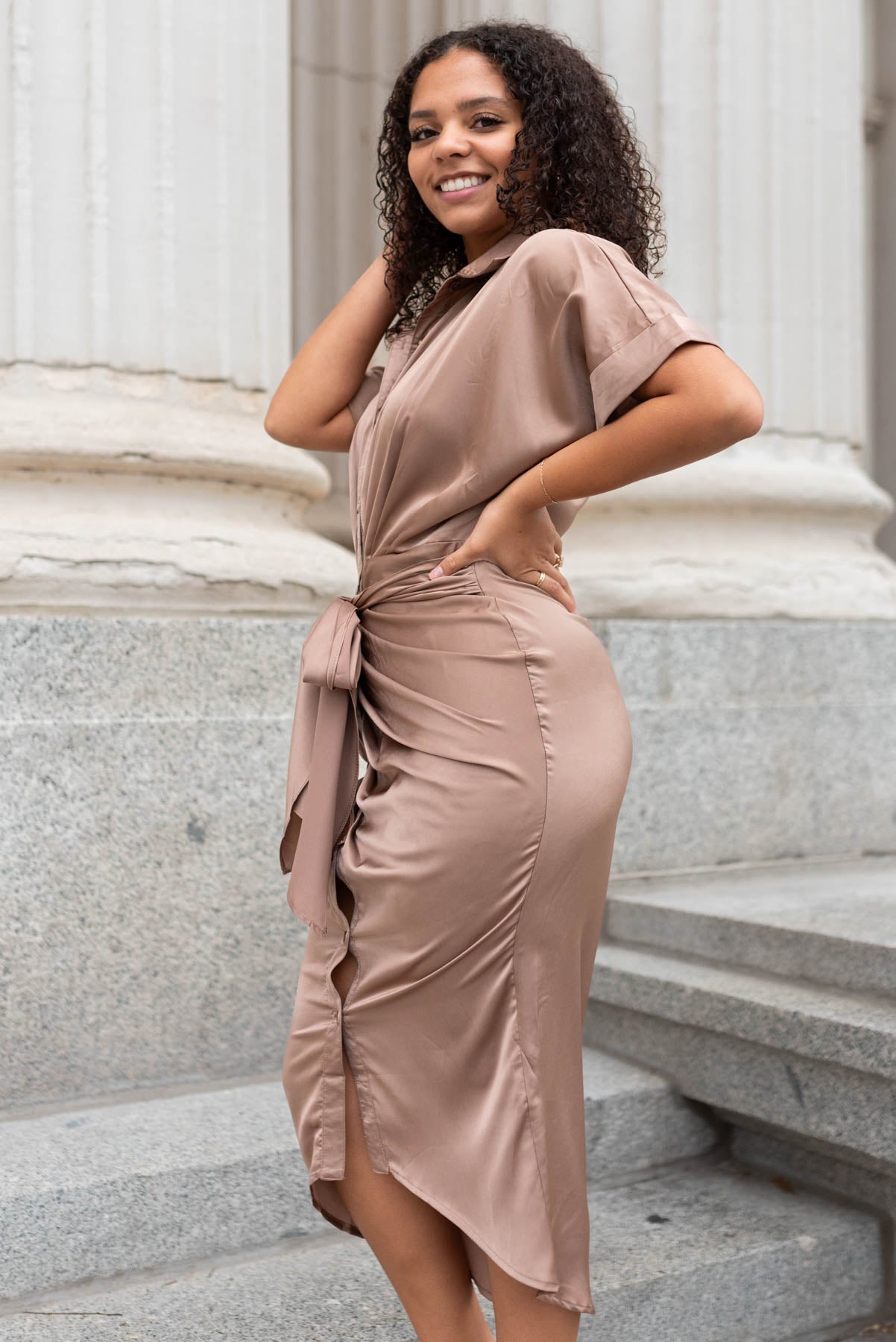 Side view of a mocha satin dress