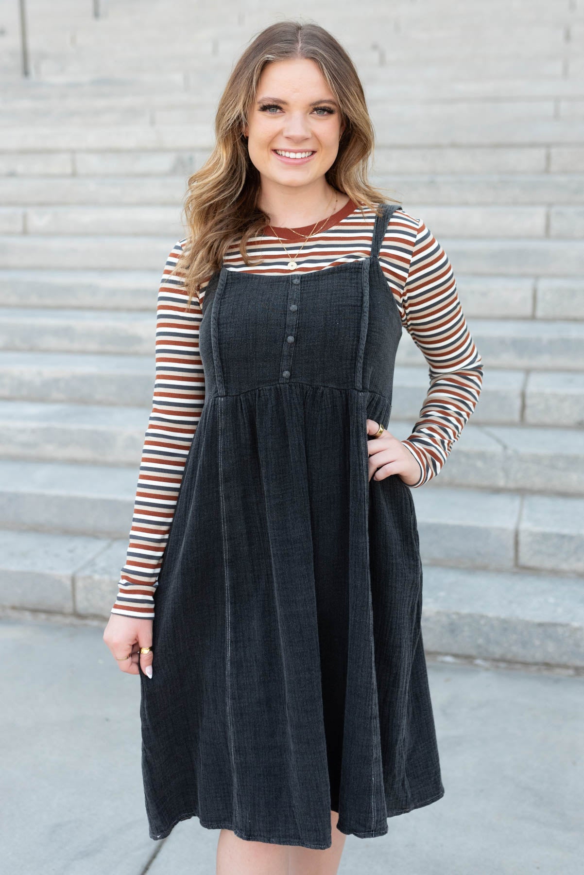 Rust stripe long sleeve top with rust trim around the neck