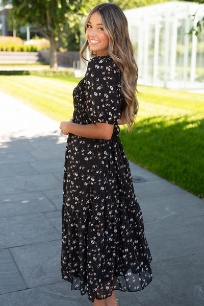 Side view of the black floral smocked dress