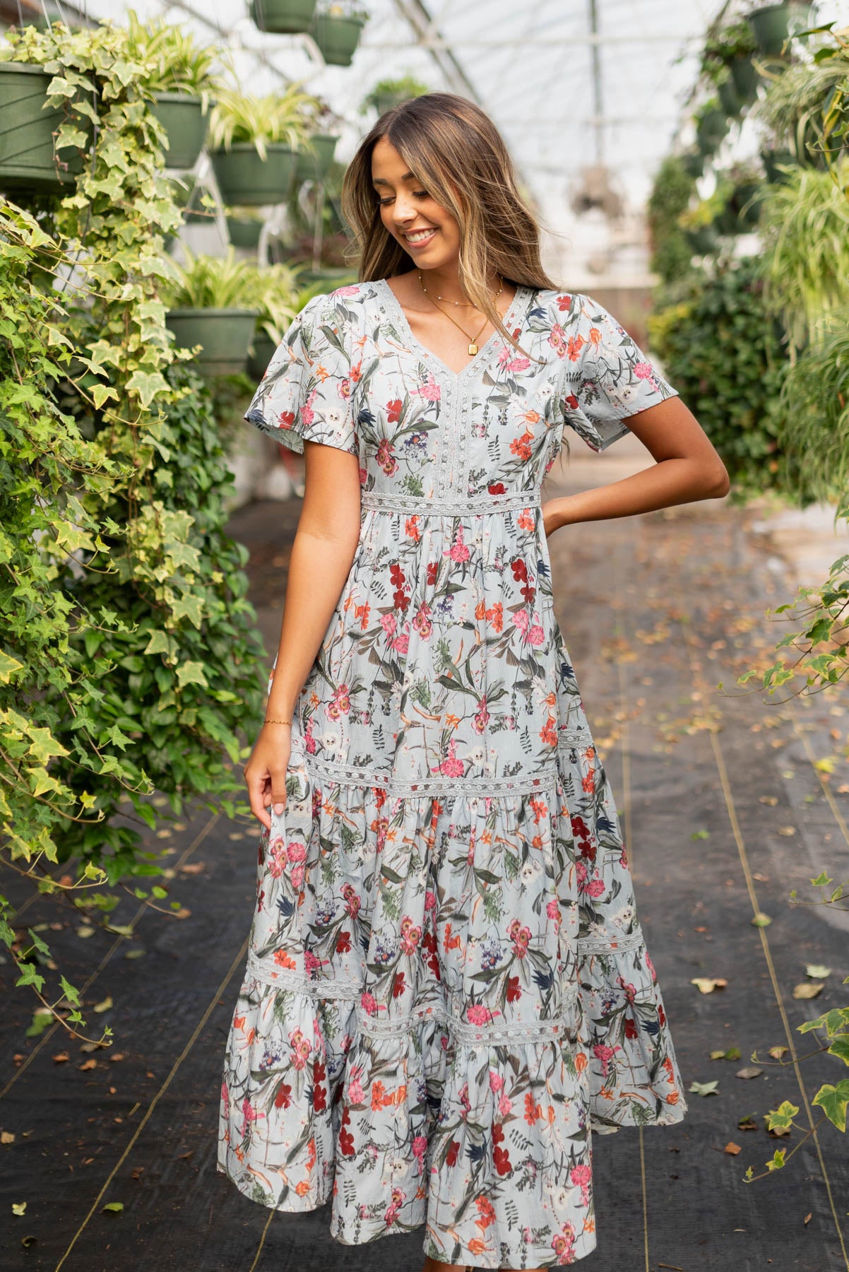 small blue floral tiered dress with short sleeves