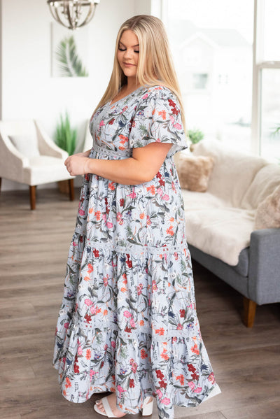 Side view of the short sleeve plus size blue floral tiered dress