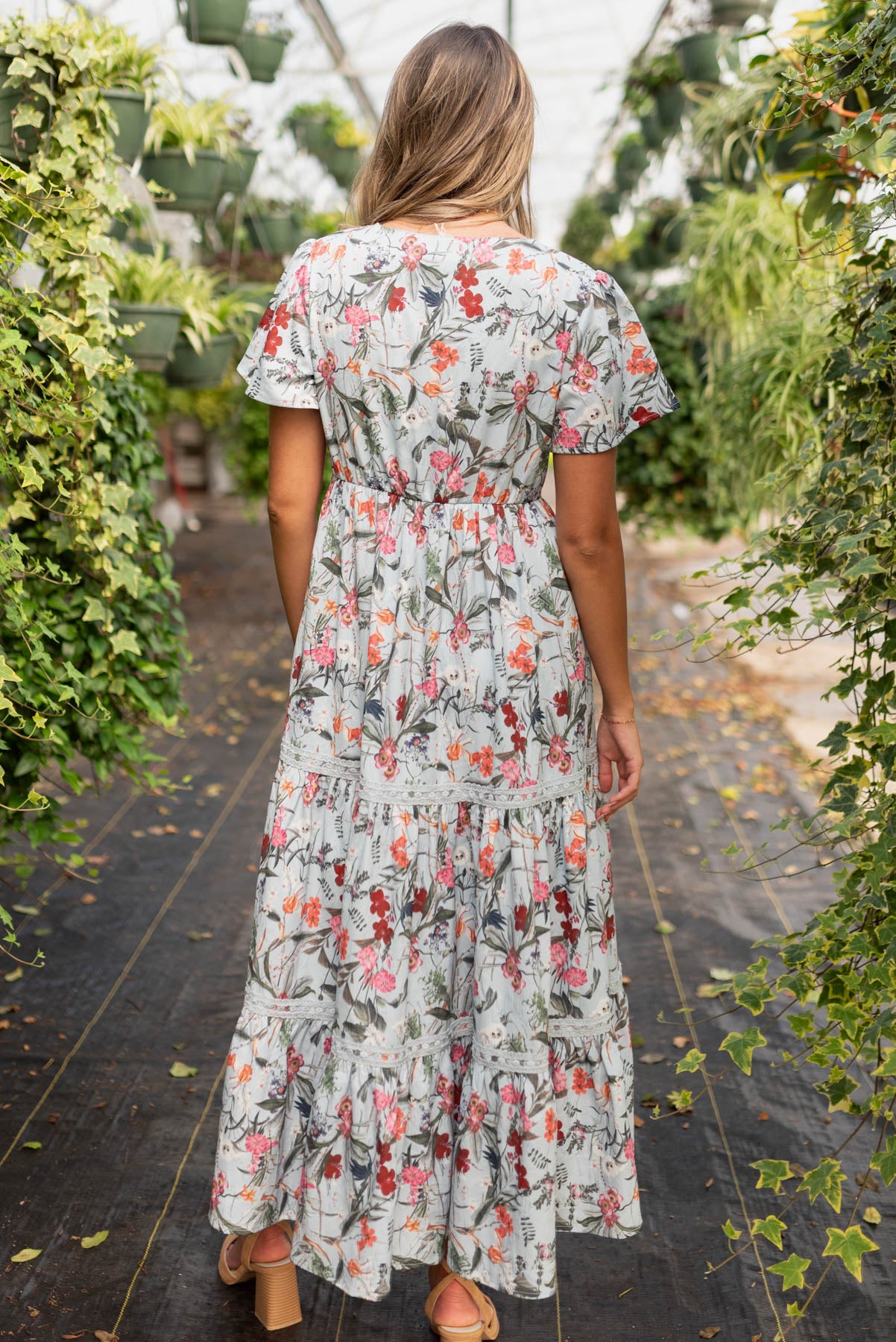 Back view of the blue floral tiered dress